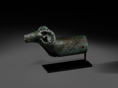 Lot 116 - A ‘RAM'S HEAD’ BRONZE CHARIOT FITTING, WESTERN MONGOLIA, CIRCA 4TH-3RD CENTURY BC