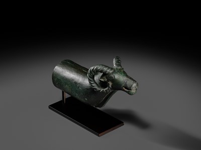 Lot 116 - A ‘RAM'S HEAD’ BRONZE CHARIOT FITTING, WESTERN MONGOLIA, CIRCA 4TH-3RD CENTURY BC