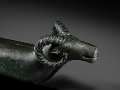 Lot 116 - A ‘RAM'S HEAD’ BRONZE CHARIOT FITTING, WESTERN MONGOLIA, CIRCA 4TH-3RD CENTURY BC