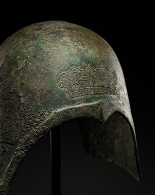 Lot 88 - A FINELY CAST, IMPORTANT AND VERY RARE BRONZE ‘TAOTIE’ HELMET, EASTERN ZHOU DYNASTY