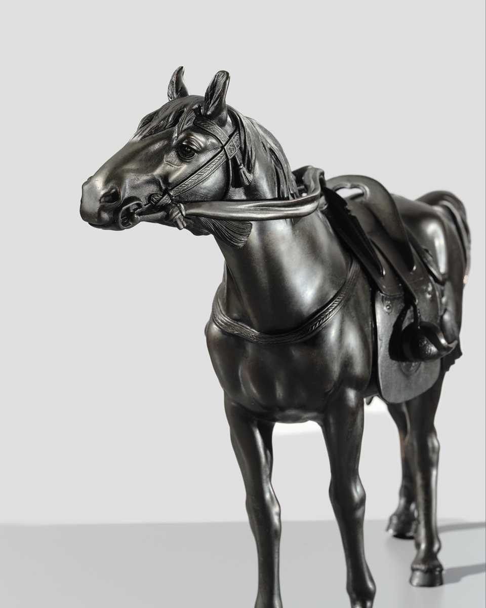 MARUKI: A FINE PORTRAIT BRONZE OKIMONO OF A HORSE