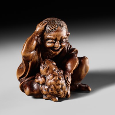 Lot 478 - A CHARMING EDO SCHOOL WOOD NETSUKE OF GAMA SENNIN AND TOAD