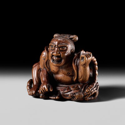 Lot 208 - MASANAO: A FINE WOOD NETSUKE OF A NIO WITH SANDAL