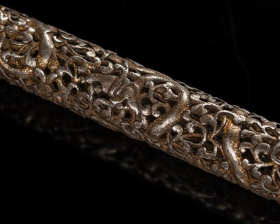 Lot 278 - A GILT-DAMASCENED AND RETICULATED IRON ‘DRAGON’ PEN HOLDER, TIBET, 15TH CENTURY