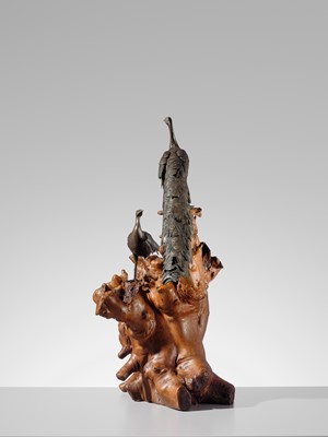 SEIYA: A LARGE BRONZE OKIMONO OF TWO PEACOCKS ON A BURLWOOD STUMP