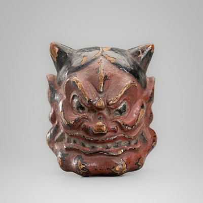 A LACQUERED WOOD MASK NETSUKE OF AN ONI