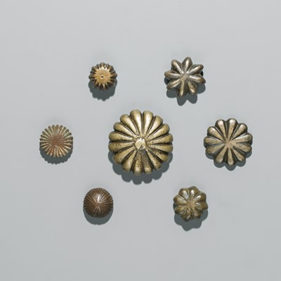 Lot 215 - A GROUP OF SEVEN BRASS ‘FLORAL’ SCALE WEIGHTS, INDIA, 20TH CENTURY OR EARLIER