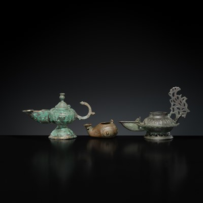 Lot 158 - A GROUP OF THREE BRONZE OIL LAMPS