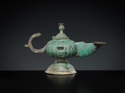 Lot 158 - A GROUP OF THREE BRONZE OIL LAMPS
