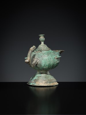 Lot 158 - A GROUP OF THREE BRONZE OIL LAMPS