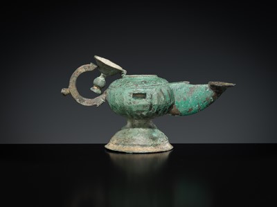 Lot 158 - A GROUP OF THREE BRONZE OIL LAMPS