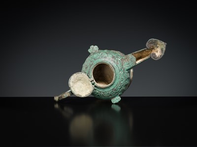 Lot 158 - A GROUP OF THREE BRONZE OIL LAMPS