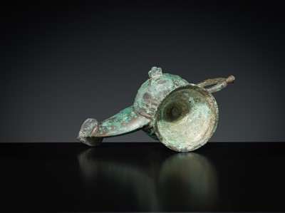 Lot 158 - A GROUP OF THREE BRONZE OIL LAMPS