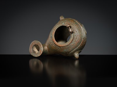 Lot 158 - A GROUP OF THREE BRONZE OIL LAMPS