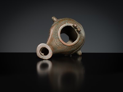 Lot 158 - A GROUP OF THREE BRONZE OIL LAMPS