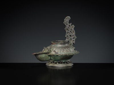 Lot 158 - A GROUP OF THREE BRONZE OIL LAMPS