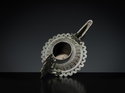 Lot 158 - A GROUP OF THREE BRONZE OIL LAMPS