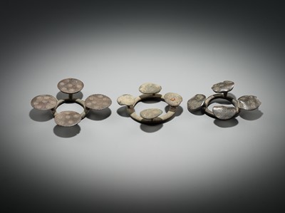 Lot 176 - A GROUP OF THREE BRONZE QUATREFOIL FIBULAS OR STRAP FITTINGS