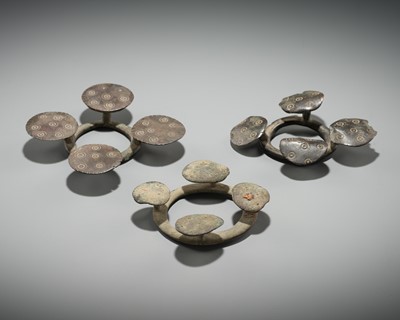 Lot 176 - A GROUP OF THREE BRONZE QUATREFOIL FIBULAS OR STRAP FITTINGS