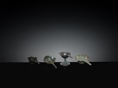 Lot 167 - A GROUP OF FOUR EARLY ISLAMIC BRONZE COSMETIC MORTARS, CIRCA 7TH-12TH CENTURY