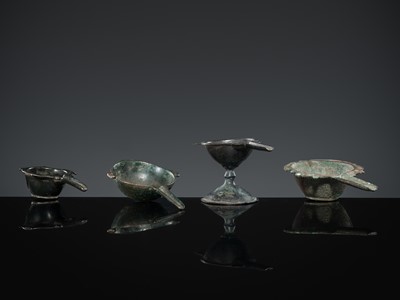 Lot 167 - A GROUP OF FOUR EARLY ISLAMIC BRONZE COSMETIC MORTARS, CIRCA 7TH-12TH CENTURY