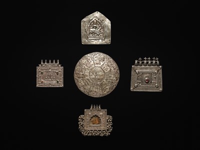 Lot 203 - A GROUP OF FIVE SILVER REPOUSSÉ AMULET PENDANTS AND PILGRIMAGE PLAQUES