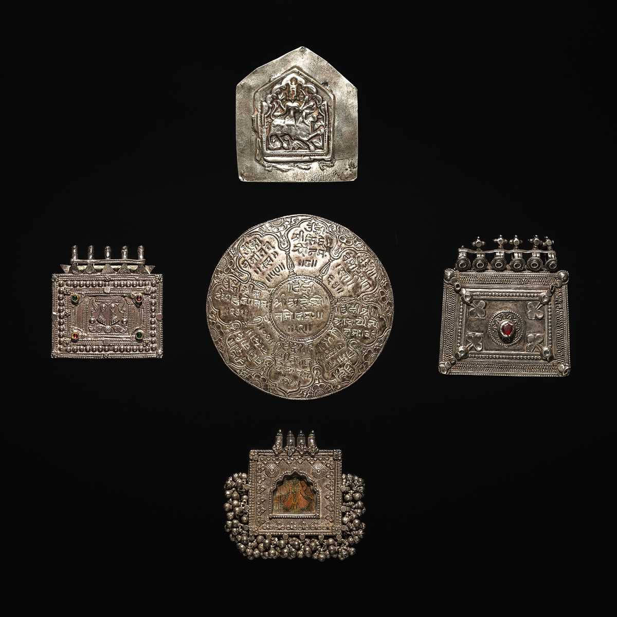 Lot 203 - A GROUP OF FIVE SILVER REPOUSSÉ AMULET PENDANTS AND PILGRIMAGE PLAQUES