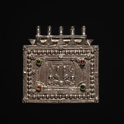 Lot 203 - A GROUP OF FIVE SILVER REPOUSSÉ AMULET PENDANTS AND PILGRIMAGE PLAQUES