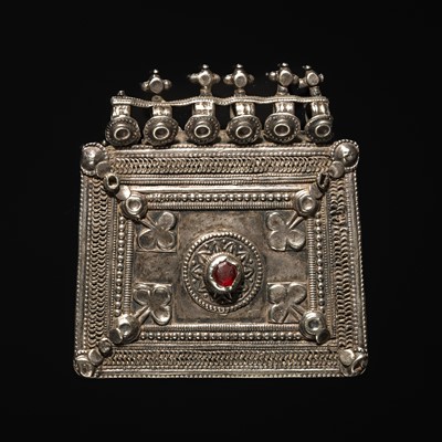 Lot 203 - A GROUP OF FIVE SILVER REPOUSSÉ AMULET PENDANTS AND PILGRIMAGE PLAQUES