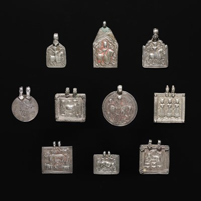 Lot 205 - A GROUP OF TEN SILVER REPOUSSÉ PILGRIMAGE AND DEVOTIONAL PENDANTS, PHUL, LATE 19TH-EARLY 20TH CENTURY