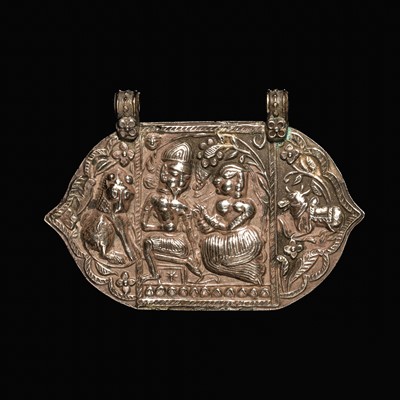 Lot 204 - A GROUP OF SIX SILVER REPOUSSÉ AMULET PENDANTS AND VOTIVE PLAQUE, HIMACHAL PRADESH AND RAJASTHAN