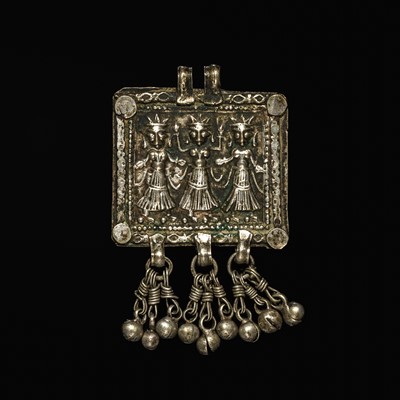 Lot 204 - A GROUP OF SIX SILVER REPOUSSÉ AMULET PENDANTS AND VOTIVE PLAQUE, HIMACHAL PRADESH AND RAJASTHAN