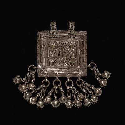 Lot 204 - A GROUP OF SIX SILVER REPOUSSÉ AMULET PENDANTS AND VOTIVE PLAQUE, HIMACHAL PRADESH AND RAJASTHAN