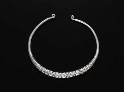 Lot 200 - A GROUP OF ONE COPPER AND TWO SILVER NECK TORQUES, 19TH-20TH CENTURY