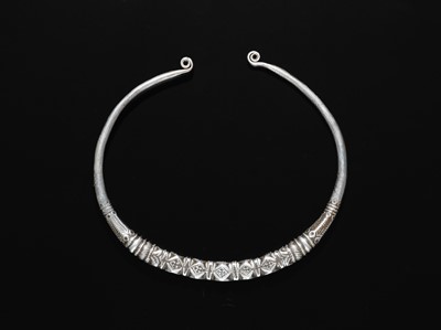 Lot 200 - A GROUP OF ONE COPPER AND TWO SILVER NECK TORQUES, 19TH-20TH CENTURY