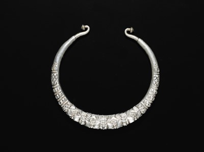 Lot 200 - A GROUP OF ONE COPPER AND TWO SILVER NECK TORQUES, 19TH-20TH CENTURY