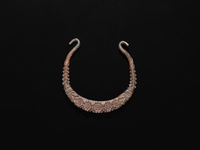 Lot 200 - A GROUP OF ONE COPPER AND TWO SILVER NECK TORQUES, 19TH-20TH CENTURY