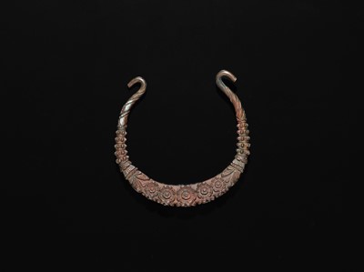 Lot 200 - A GROUP OF ONE COPPER AND TWO SILVER NECK TORQUES, 19TH-20TH CENTURY