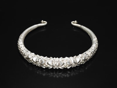 Lot 200 - A GROUP OF ONE COPPER AND TWO SILVER NECK TORQUES, 19TH-20TH CENTURY