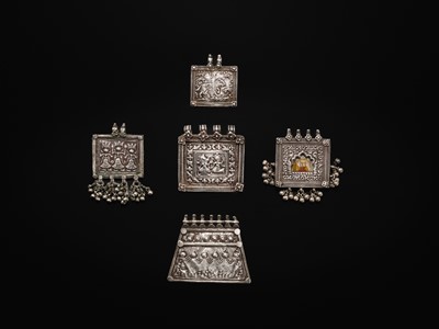 Lot 110 - A FINE GROUP OF FIVE SILVER REPOUSSÉ AMULETS, HIMACHAL PRADESH AND RAJASTHAN