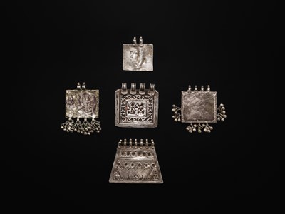 Lot 110 - A FINE GROUP OF FIVE SILVER REPOUSSÉ AMULETS, HIMACHAL PRADESH AND RAJASTHAN
