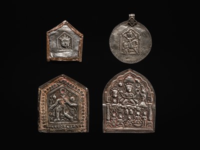 Lot 109 - A GROUP OF THREE SILVER REPOUSSÉ VOTIVE PLAQUES AND A PILGRIMAGE AND DEVOTIONAL PENDANT, PHUL, MAHARASHTRA, 19TH CENTURY OR EARLIER