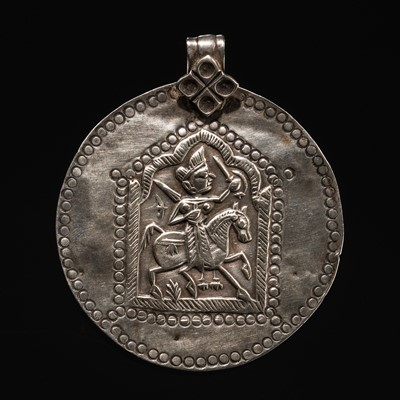 Lot 109 - A GROUP OF THREE SILVER REPOUSSÉ VOTIVE PLAQUES AND A PILGRIMAGE AND DEVOTIONAL PENDANT, PHUL, MAHARASHTRA, 19TH CENTURY OR EARLIER