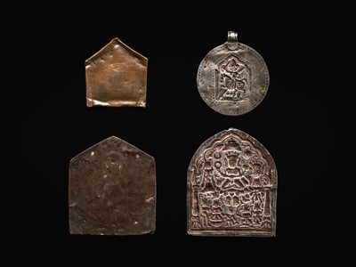 Lot 109 - A GROUP OF THREE SILVER REPOUSSÉ VOTIVE PLAQUES AND A PILGRIMAGE AND DEVOTIONAL PENDANT, PHUL, MAHARASHTRA, 19TH CENTURY OR EARLIER