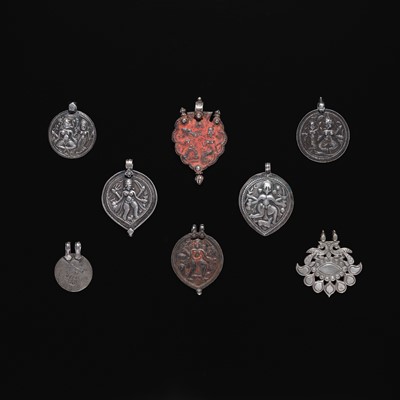 Lot 207 - A GROUP OF SEVEN SILVER REPOUSSÉ PENDANTS, LATE 19TH-EARLY 20TH CENTURY