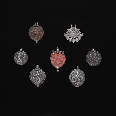 Lot 207 - A GROUP OF SEVEN SILVER REPOUSSÉ PENDANTS, LATE 19TH-EARLY 20TH CENTURY