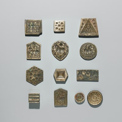 Lot 218 - A GROUP OF THIRTEEN BRASS MOLDS, INDIA, 20TH CENTURY OR EARLIER