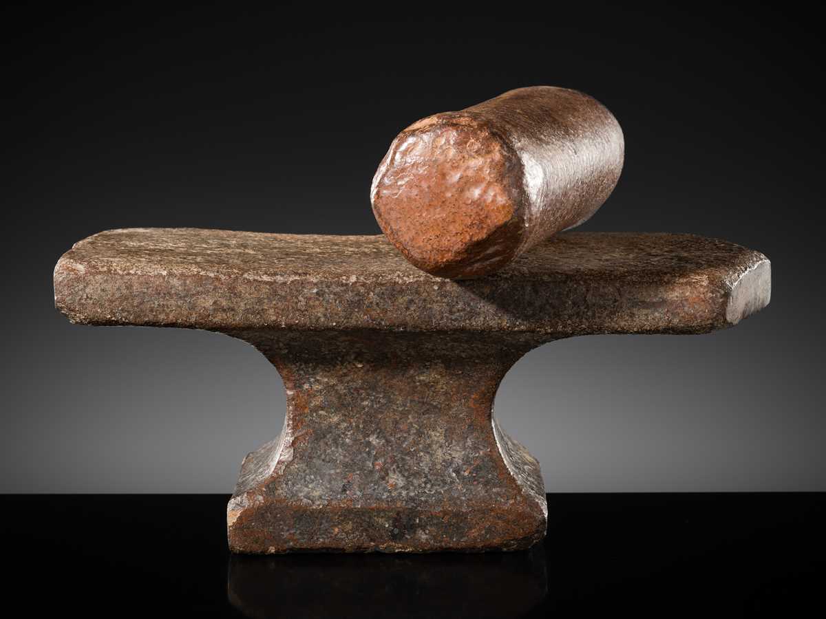 Lot 6 - A SANDSTONE PESANI (GRINDING STONE) AND GRINDER, ANGKOR PERIOD