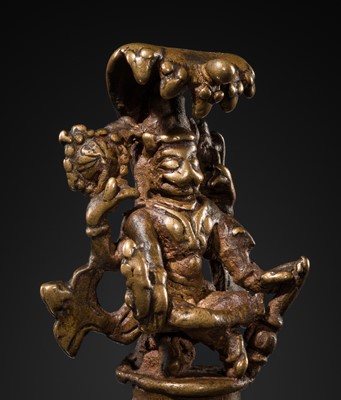 Lot 82 - A MINIATURE BRONZE FIGURE OF YOGA NARASIMHA WITH NAGA HOOD, 18TH-19TH CENTURY