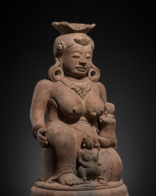 Lot 513 - A MAJAPAHIT TERRACOTTA FIGURE OF MEN BRAJUT (HARITI) WITH CHILDREN